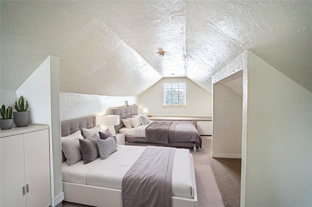 bedroom featuring vaulted ceiling, carpet, and a textured ceiling