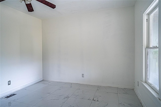 unfurnished room featuring ceiling fan