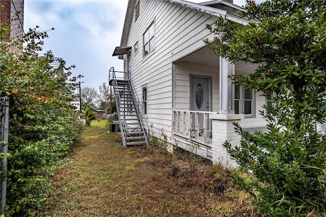 view of side of home featuring central AC unit