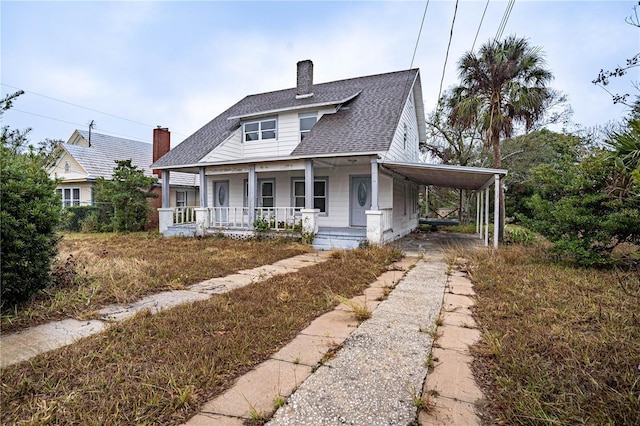 view of front of house with a carport and covered porch