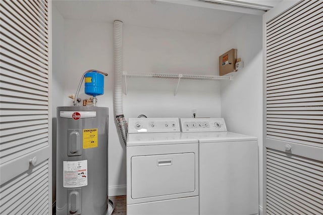 laundry area with washing machine and dryer and electric water heater