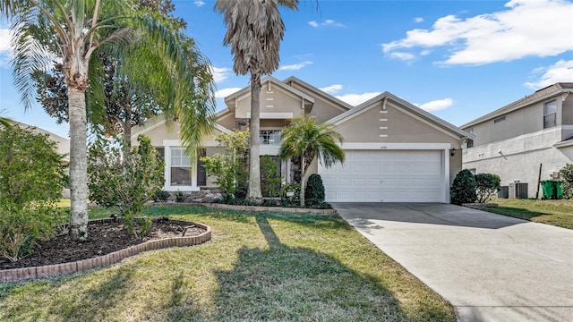 view of front of property with central AC unit, a garage, and a front yard