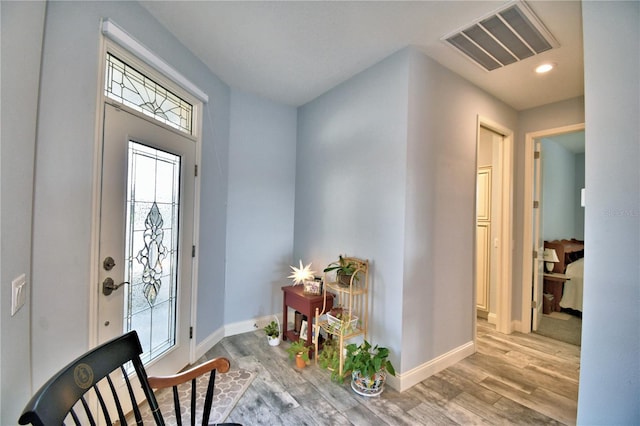 entryway with light hardwood / wood-style flooring