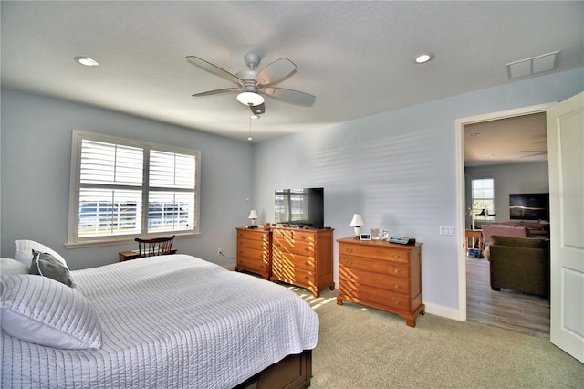 carpeted bedroom with ceiling fan