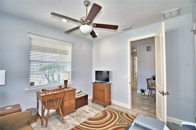 office area with ceiling fan and light wood-type flooring