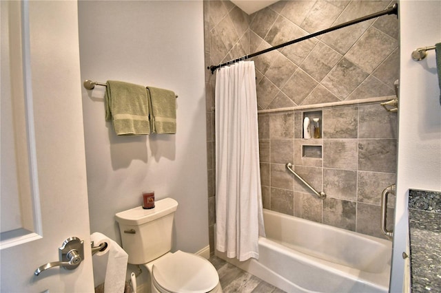 bathroom with toilet, hardwood / wood-style floors, and shower / bath combo