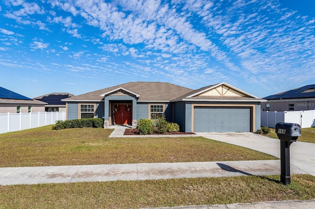 ranch-style house featuring a garage and a front lawn