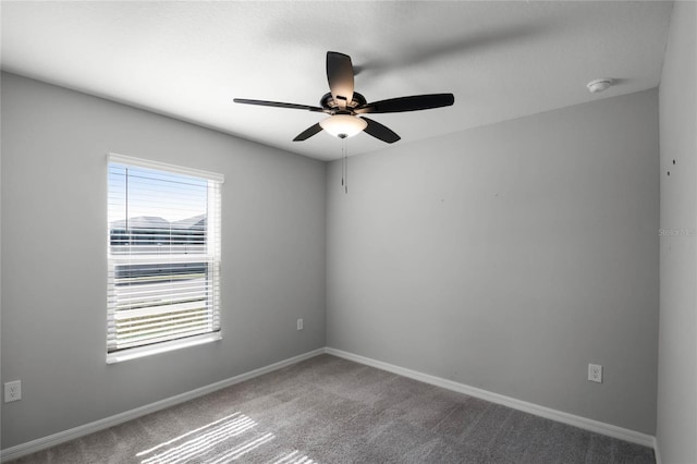 carpeted empty room with ceiling fan