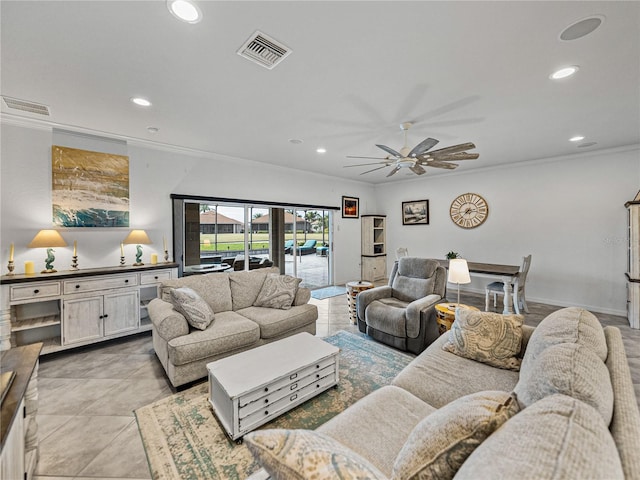 living room with ornamental molding and ceiling fan