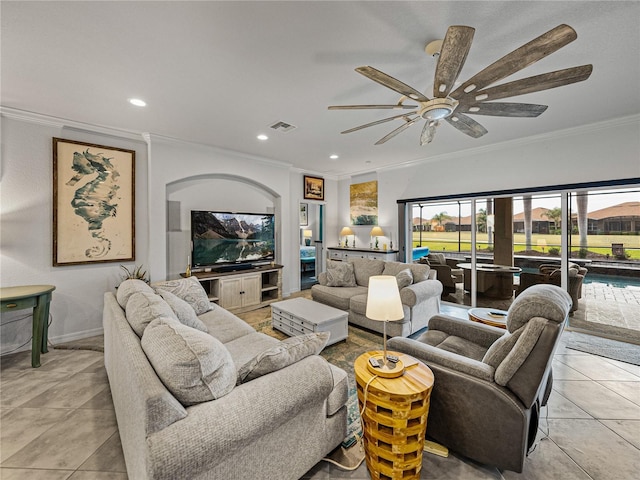 living room featuring ornamental molding, ceiling fan, and light tile patterned flooring