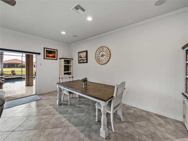 tiled dining room with crown molding