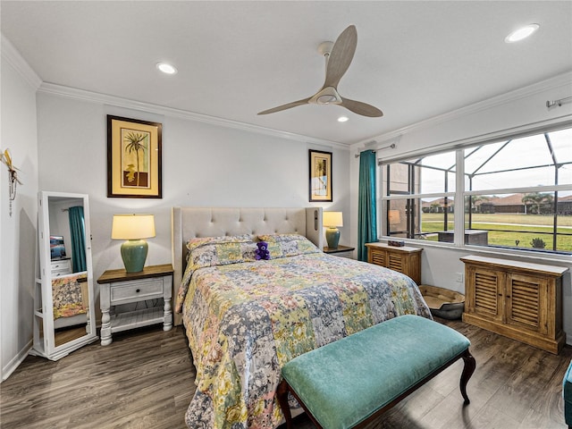 bedroom with ceiling fan, ornamental molding, and dark hardwood / wood-style flooring