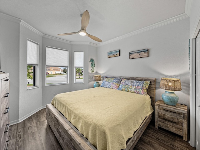 bedroom with ornamental molding, ceiling fan, and dark hardwood / wood-style flooring