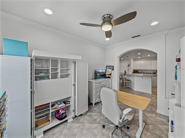 home office with crown molding and ceiling fan