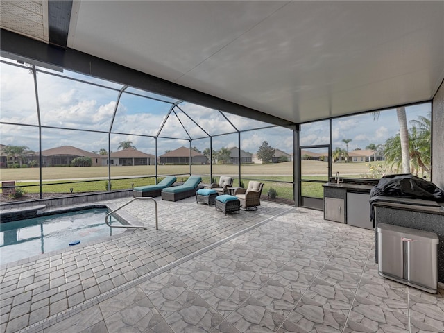 exterior space with a lanai, an outdoor hangout area, and sink