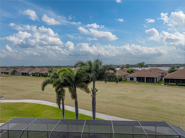 view of home's community with a yard