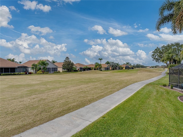 view of home's community with a yard