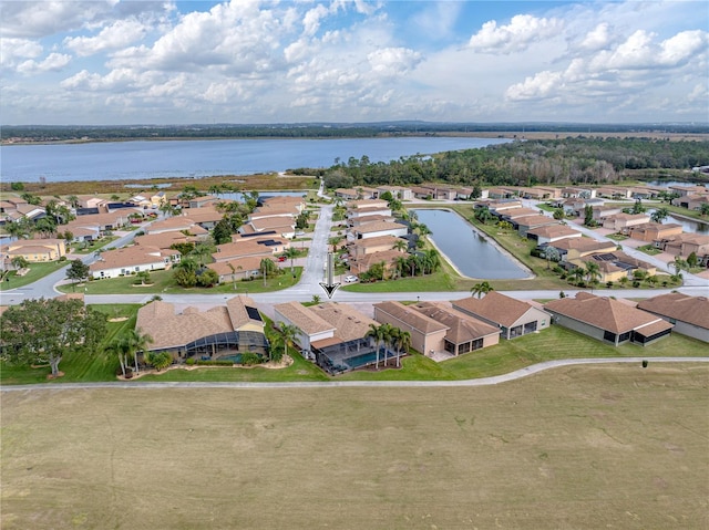 birds eye view of property with a water view