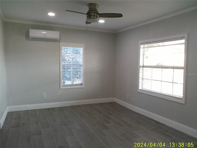 unfurnished room featuring a wall mounted air conditioner, ornamental molding, and a healthy amount of sunlight