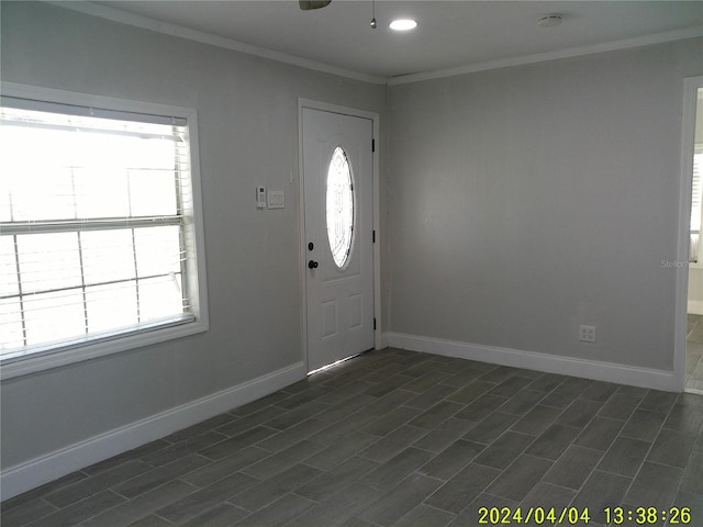 entrance foyer featuring crown molding