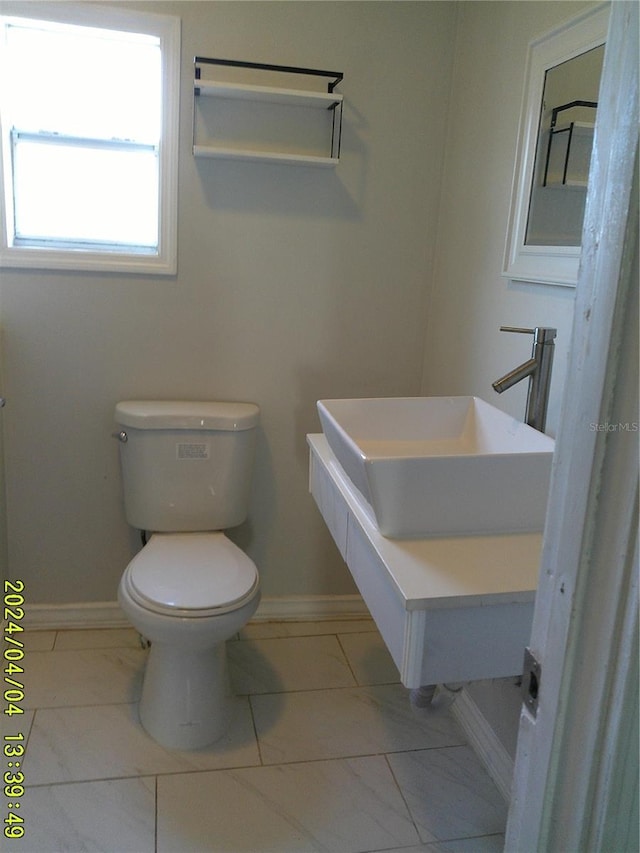 bathroom with toilet and sink