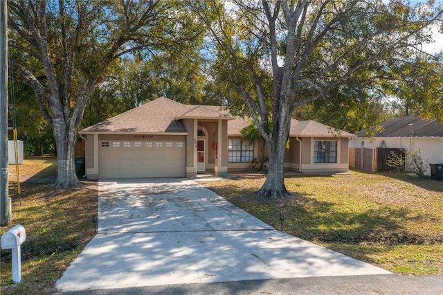 view of front facade featuring a garage and a front lawn