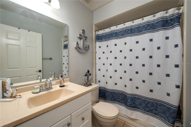 bathroom featuring vanity, toilet, and curtained shower