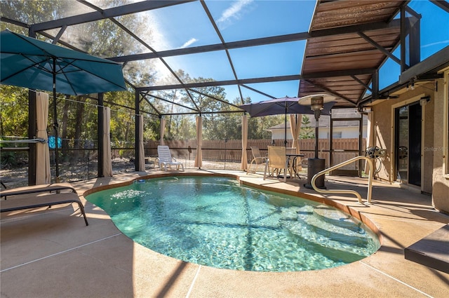 view of pool featuring a lanai and a patio