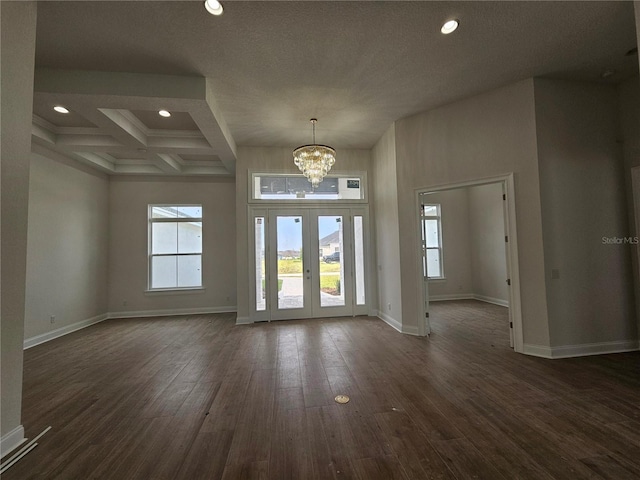 entryway featuring dark wood-style floors, recessed lighting, a chandelier, and baseboards