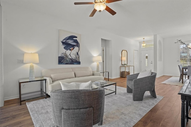 living room with hardwood / wood-style flooring and ceiling fan