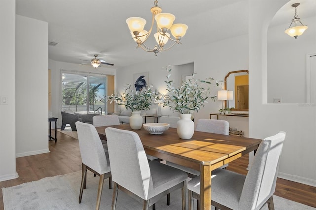 dining space with hardwood / wood-style floors and ceiling fan