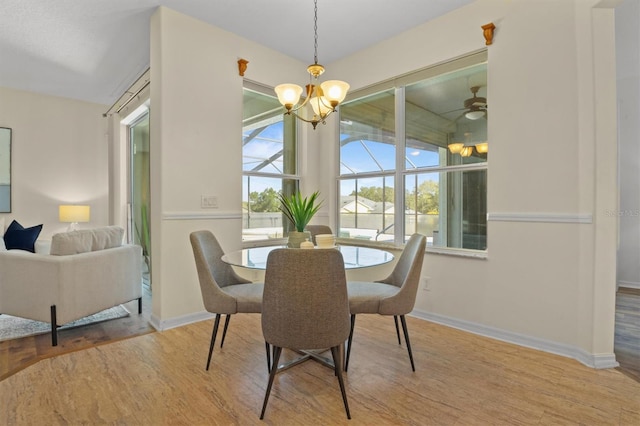 dining room with an inviting chandelier and wood-type flooring