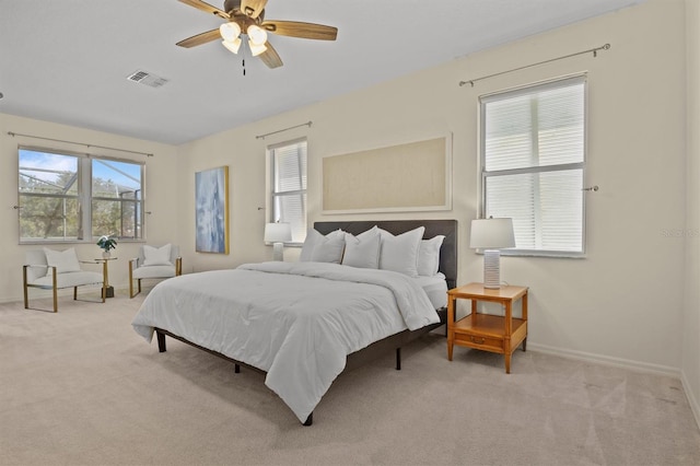 carpeted bedroom featuring ceiling fan