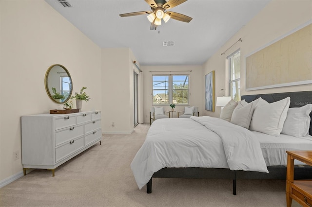 bedroom with light carpet and ceiling fan