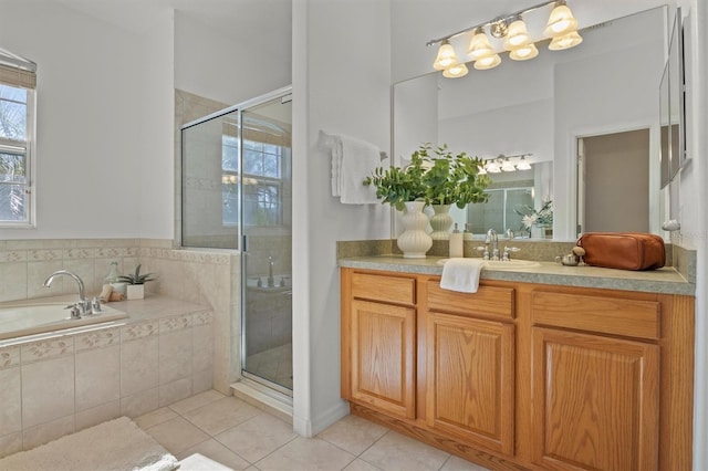 bathroom with tile patterned flooring, vanity, and independent shower and bath