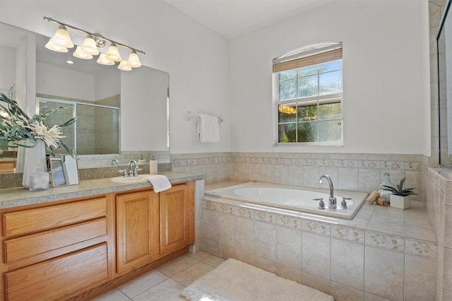 bathroom featuring vanity, separate shower and tub, and tile patterned flooring