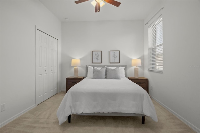 carpeted bedroom with a closet and ceiling fan