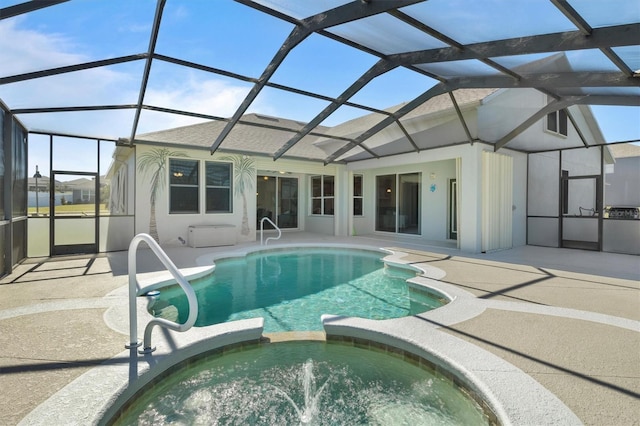 view of swimming pool with an in ground hot tub, a lanai, and a patio area