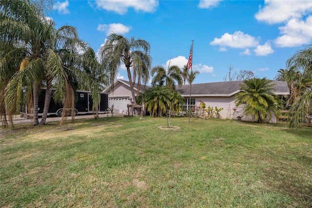 view of front of home featuring a garage and a front lawn