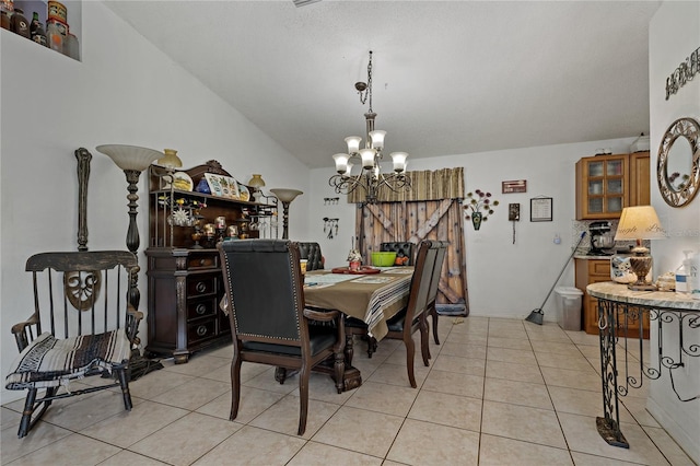 tiled dining area featuring a notable chandelier