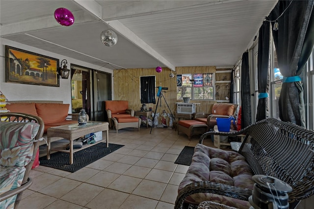 interior space featuring cooling unit and beam ceiling