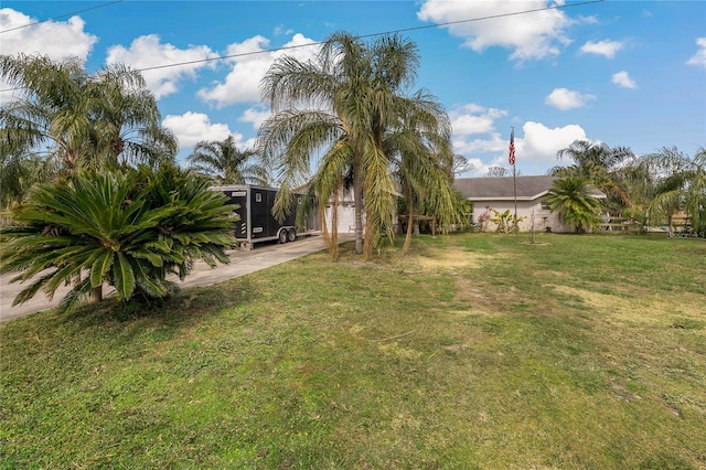 view of yard featuring a garage