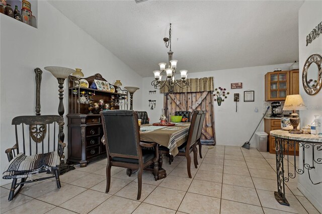 dining room featuring light tile patterned flooring and a notable chandelier