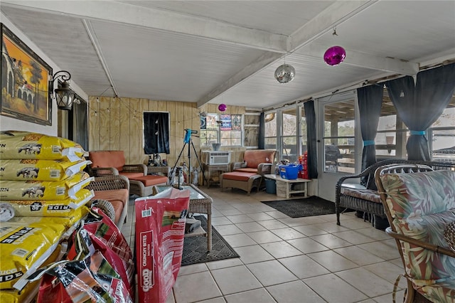 sunroom / solarium featuring cooling unit and beam ceiling