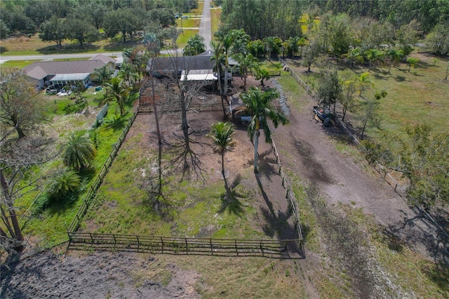 birds eye view of property with a rural view