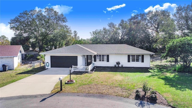 ranch-style home with a garage and a front yard