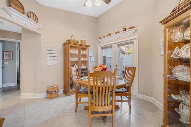 dining room featuring light tile patterned floors, ceiling fan, and french doors