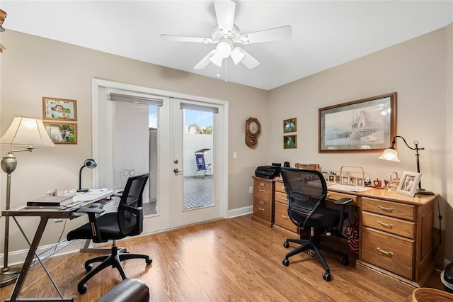 home office featuring french doors, ceiling fan, and light hardwood / wood-style floors