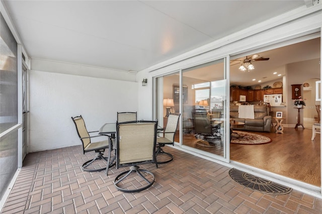 sunroom featuring vaulted ceiling