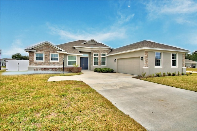 view of front of property featuring a garage and a front lawn